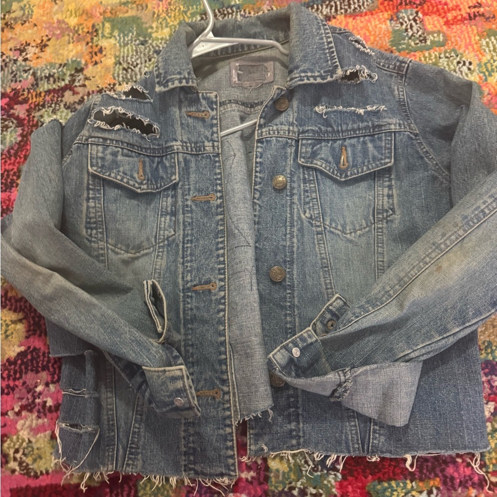Vintage Jean jacket with fake Chanel C’s on the back.